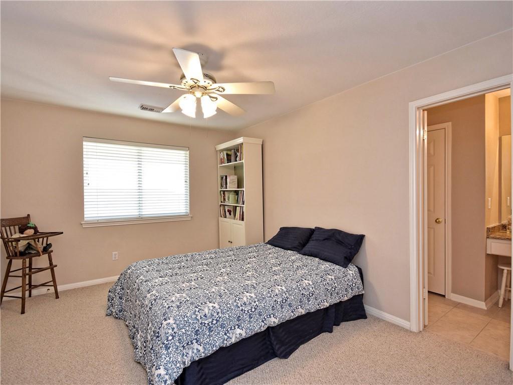 9216 Evening Primrose Path Austin, TX 78750 - Photo 24 of 30 a bedroom with a bed and window