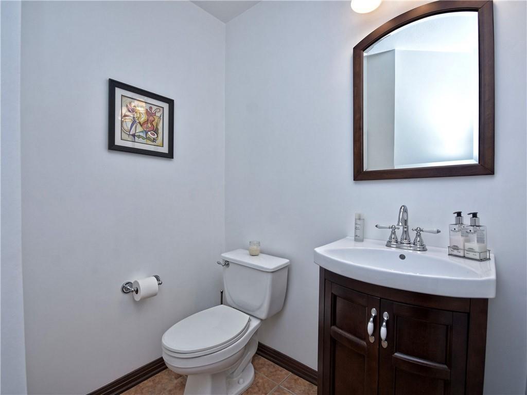 9216 Evening Primrose Path Austin, TX 78750 - Photo 26 of 30 a bathroom with a toilet a sink and mirror