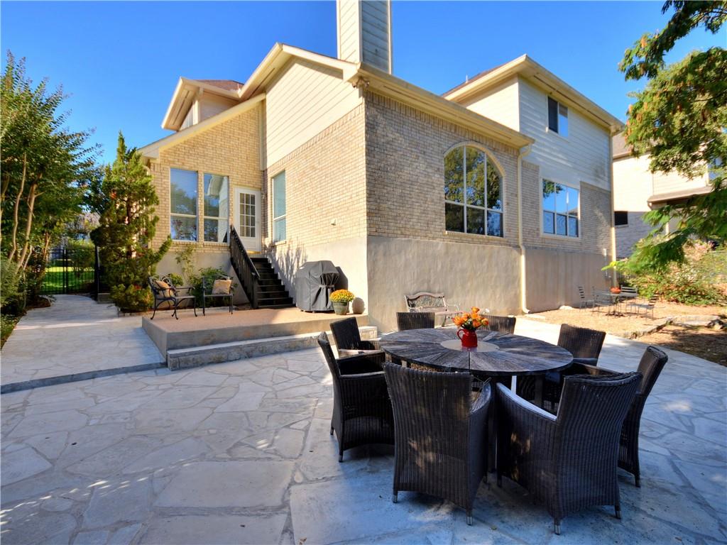 9216 Evening Primrose Path Austin, TX 78750 - Photo 28 of 30 a view of a patio with dining table and chairs