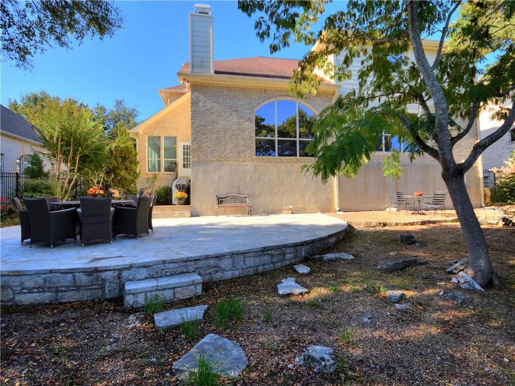 9216 Evening Primrose Path Austin, TX 78750 - Photo 29 of 30 a view of a backyard with plants and trees