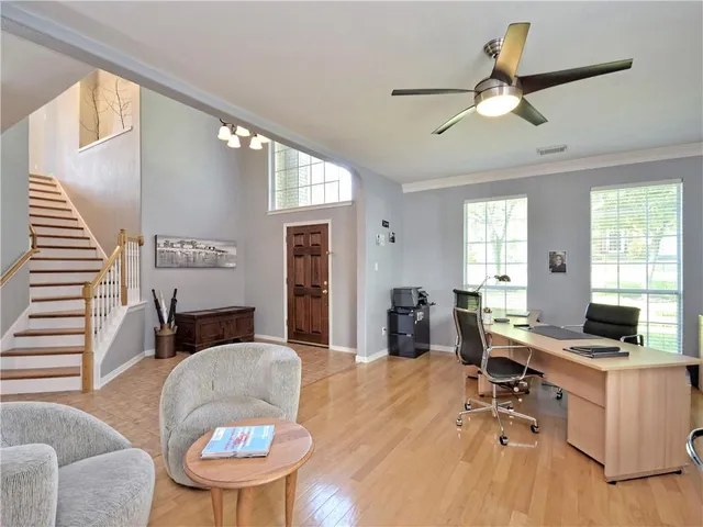 a workspace with furniture window and wooden floor