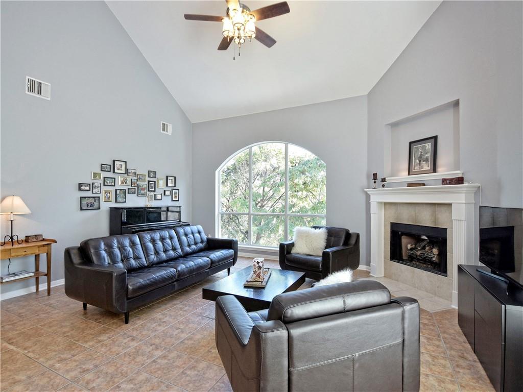 9216 Evening Primrose Path Austin, TX 78750 - Photo 8 of 30 a living room with furniture and a fireplace