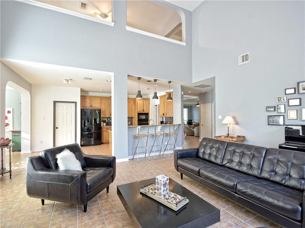 9216 Evening Primrose Path Austin, TX 78750 - Photo 10 of 30 a living room with furniture and a couch