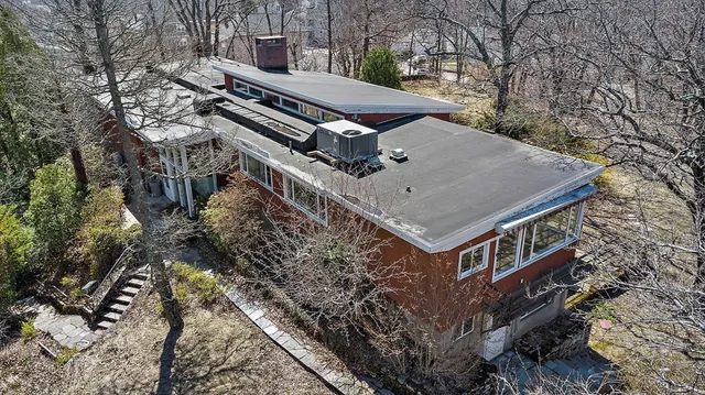 a aerial view of a house with a trees