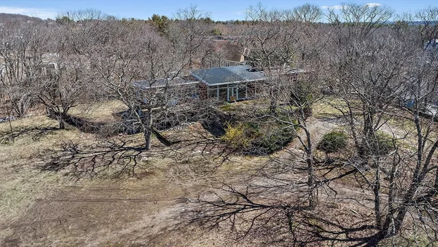 a view of a mountain with a yard