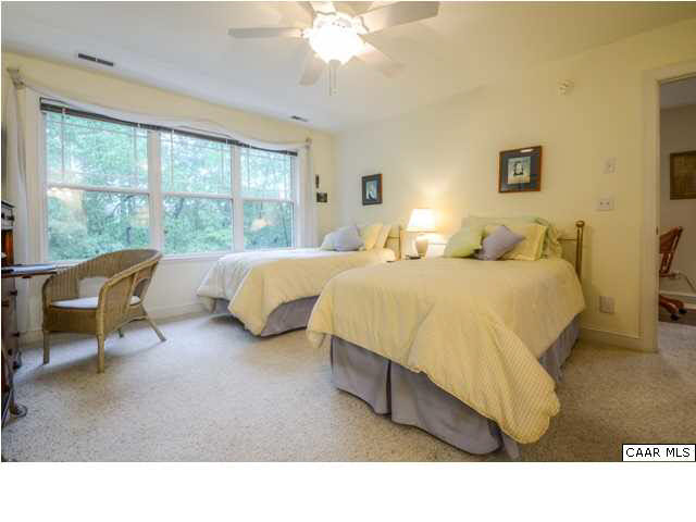 60 Roslyn Heights Road Charlottesville, VA 22901 - Photo 38 of 40 a living room with a bed furniture and a large window