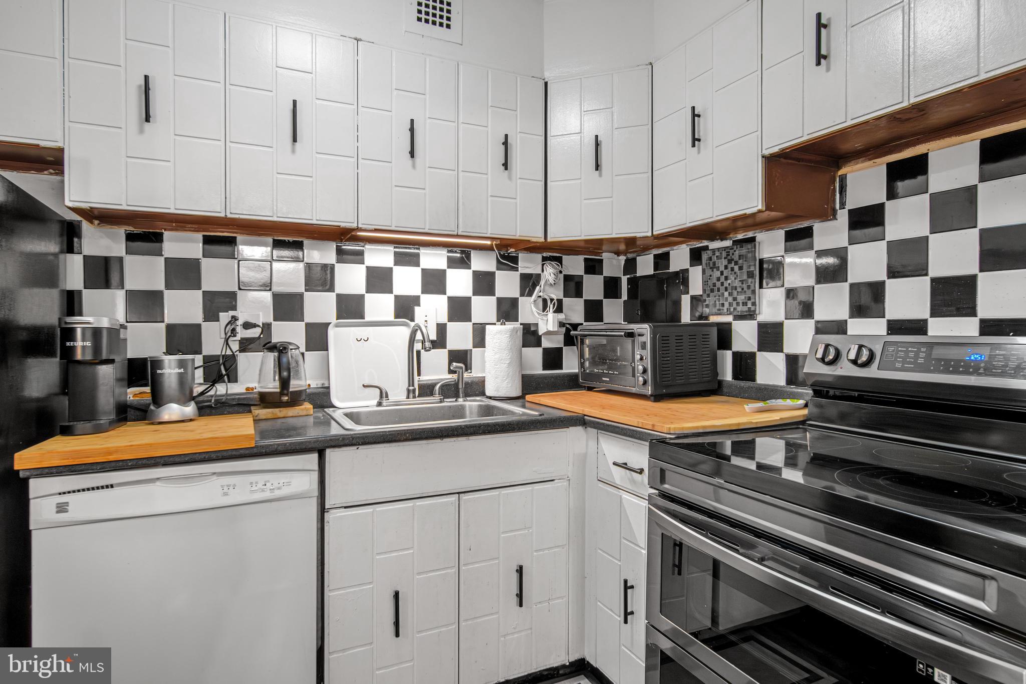 700 7th Street Southwest, Unit 119 Washington, DC 20024 - Photo 12 of 31 a kitchen with a sink and cabinets