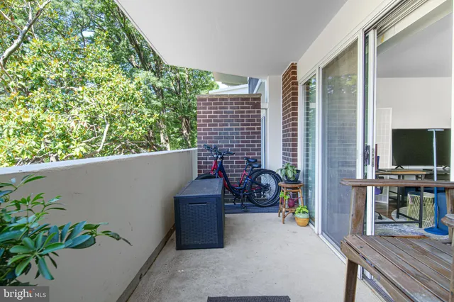 a view of a balcony with chairs
