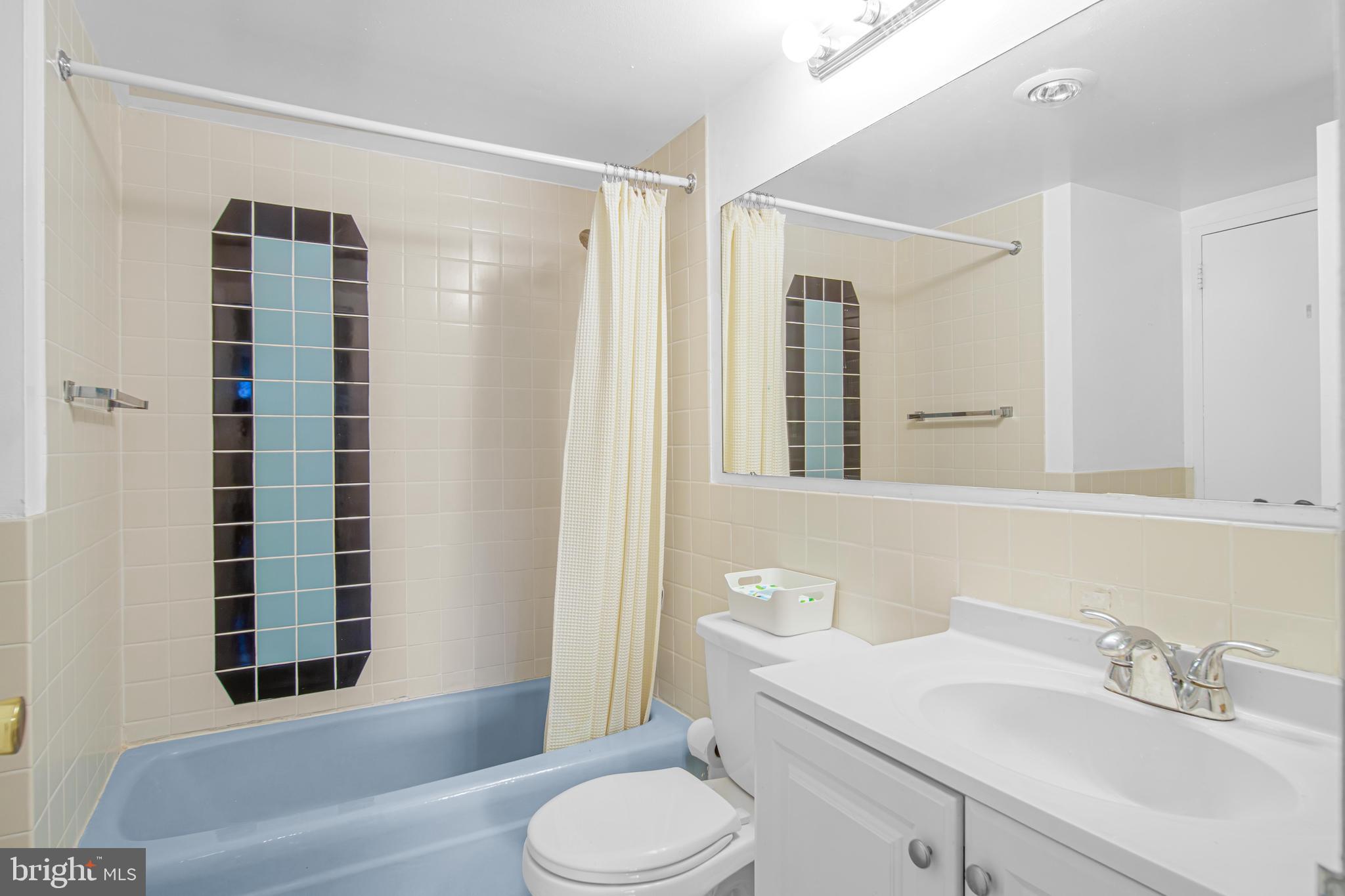 700 7th Street Southwest, Unit 119 Washington, DC 20024 - Photo 9 of 31 a bathroom with a sink toilet and shower