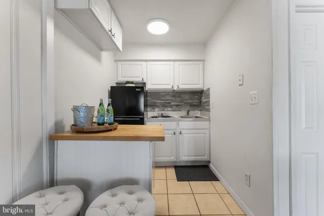 a kitchen with stainless steel appliances a sink stove and cabinets