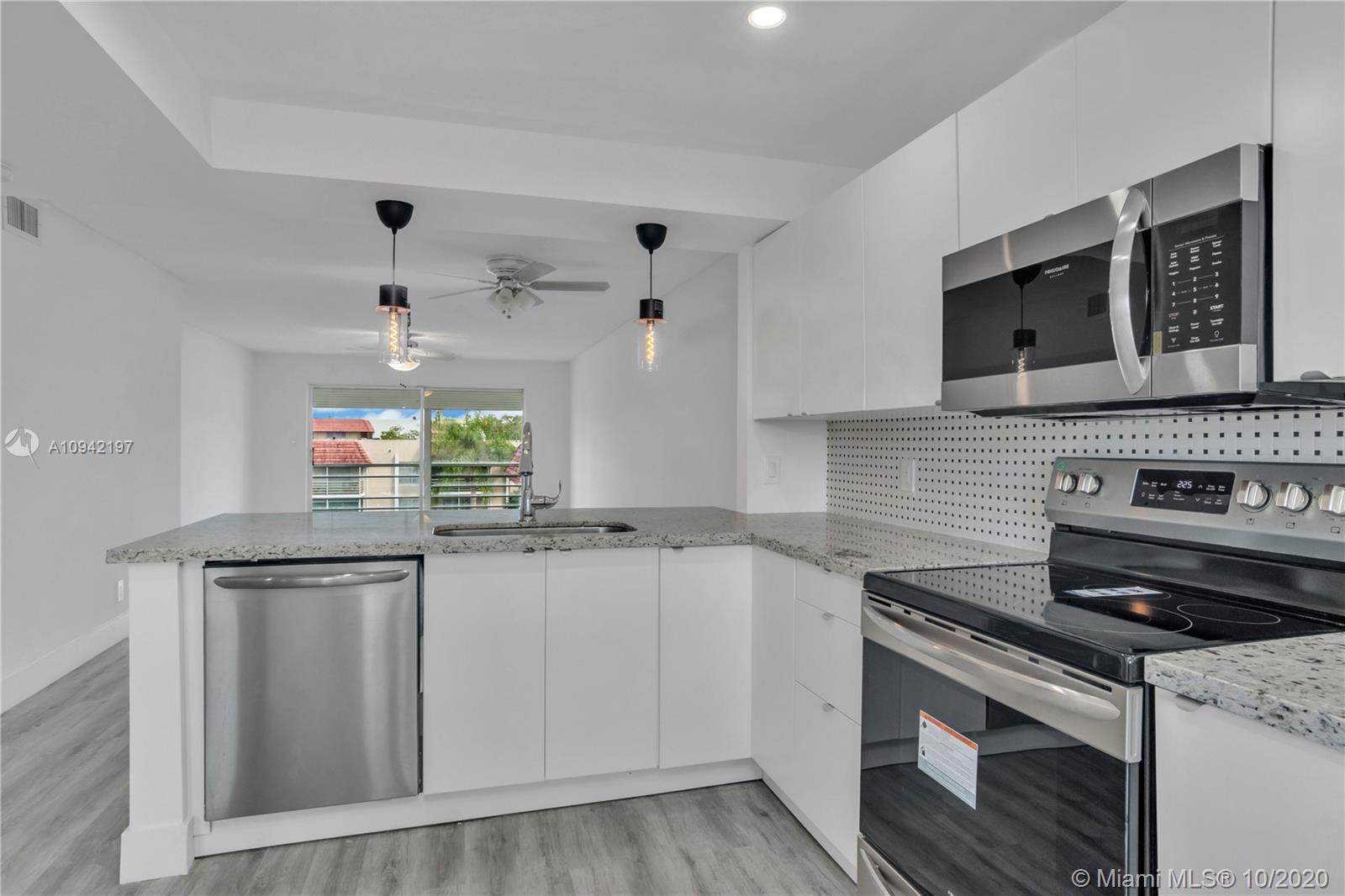 Completely renovated kitchen with granite countertop, brand new stainless steel appliances, cabinets,lighting