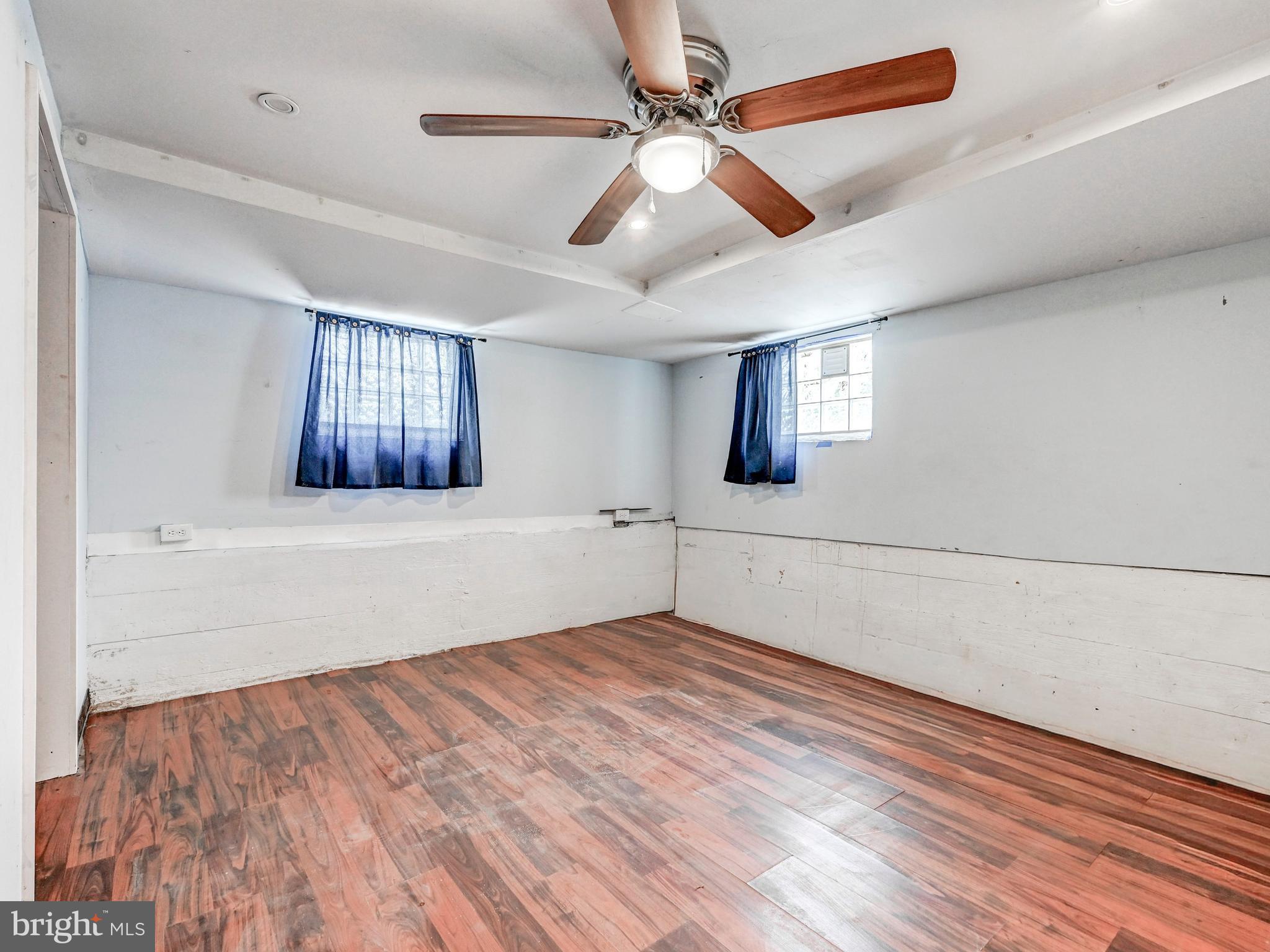 3206 Lynch Road Baltimore, MD 21219 - Photo 33 of 70 wooden floor in an empty room with a window