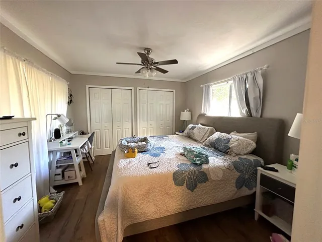 a bed room with a bed and a window