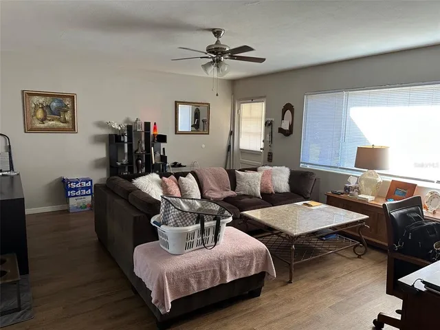 a living room with furniture and a window