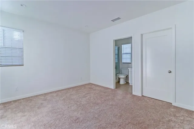 a table with white wooden cabinets