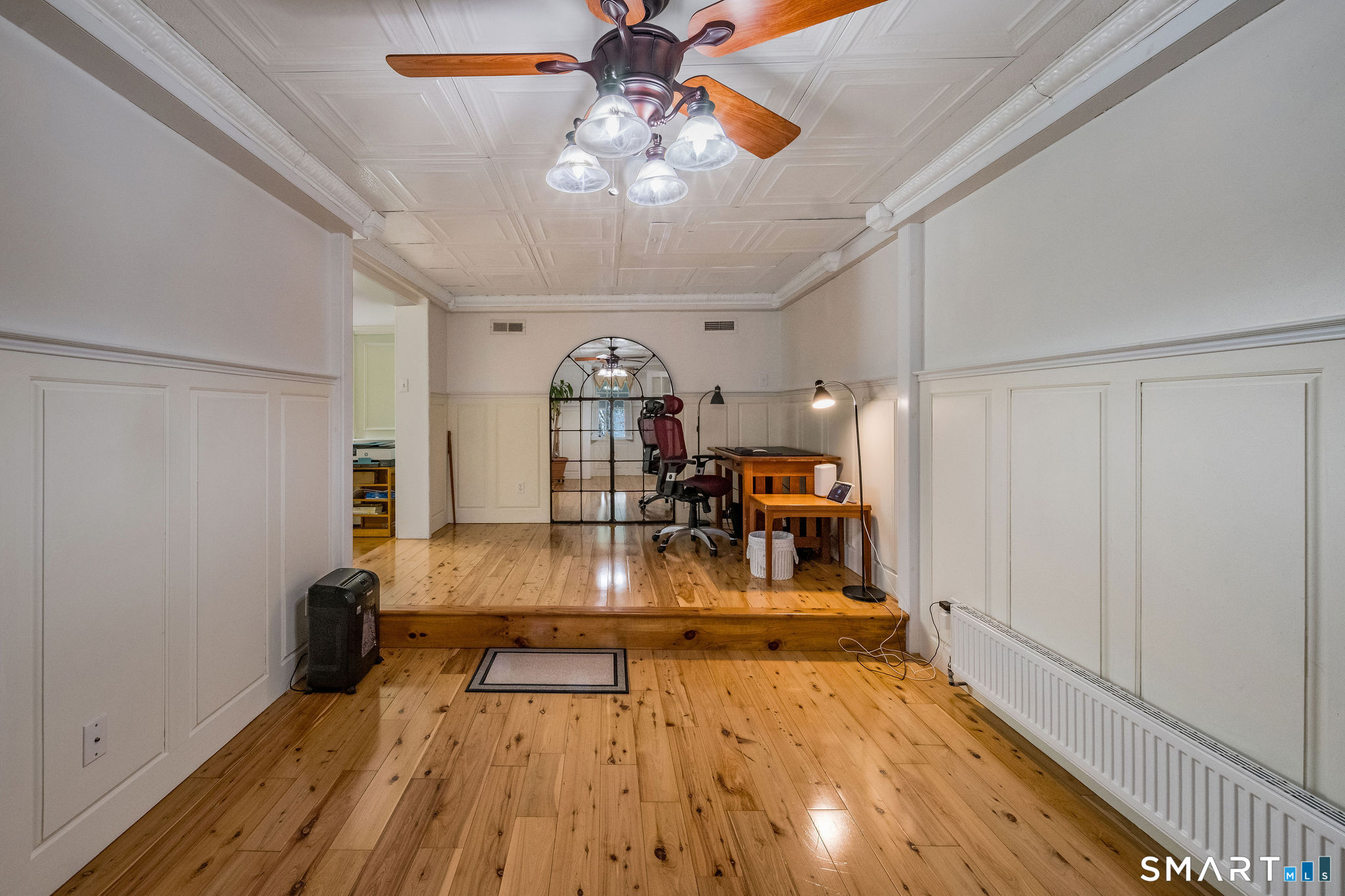 6 Cedar Island Avenue Clinton, CT 06413 - Photo 19 of 36 a view of a dining room with furniture a chandelier and wooden floor