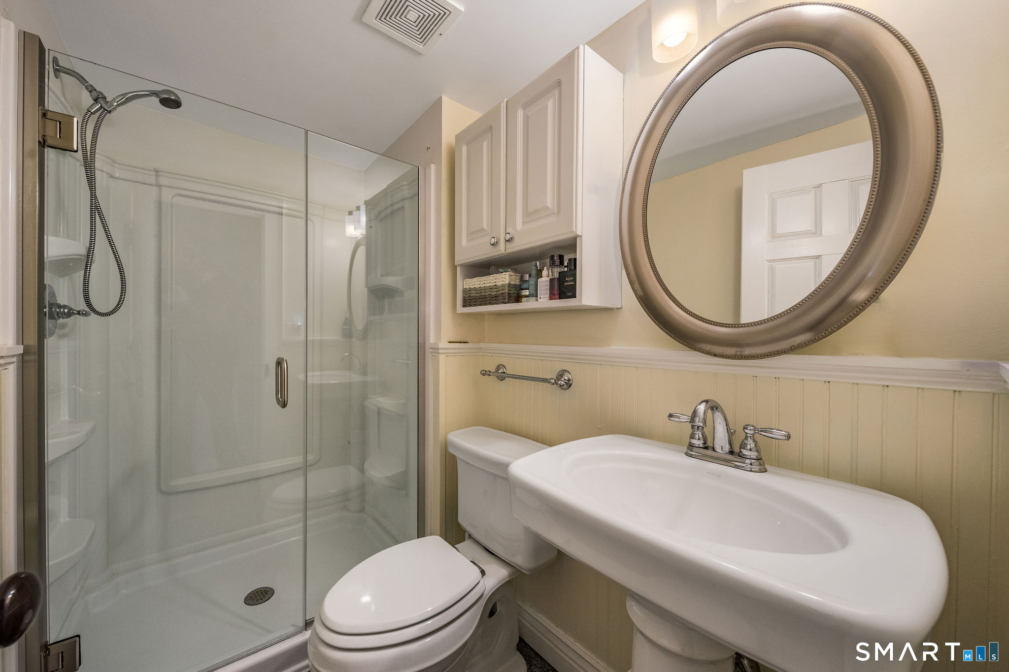 6 Cedar Island Avenue Clinton, CT 06413 - Photo 26 of 36 a bathroom with a sink a toilet and a mirror