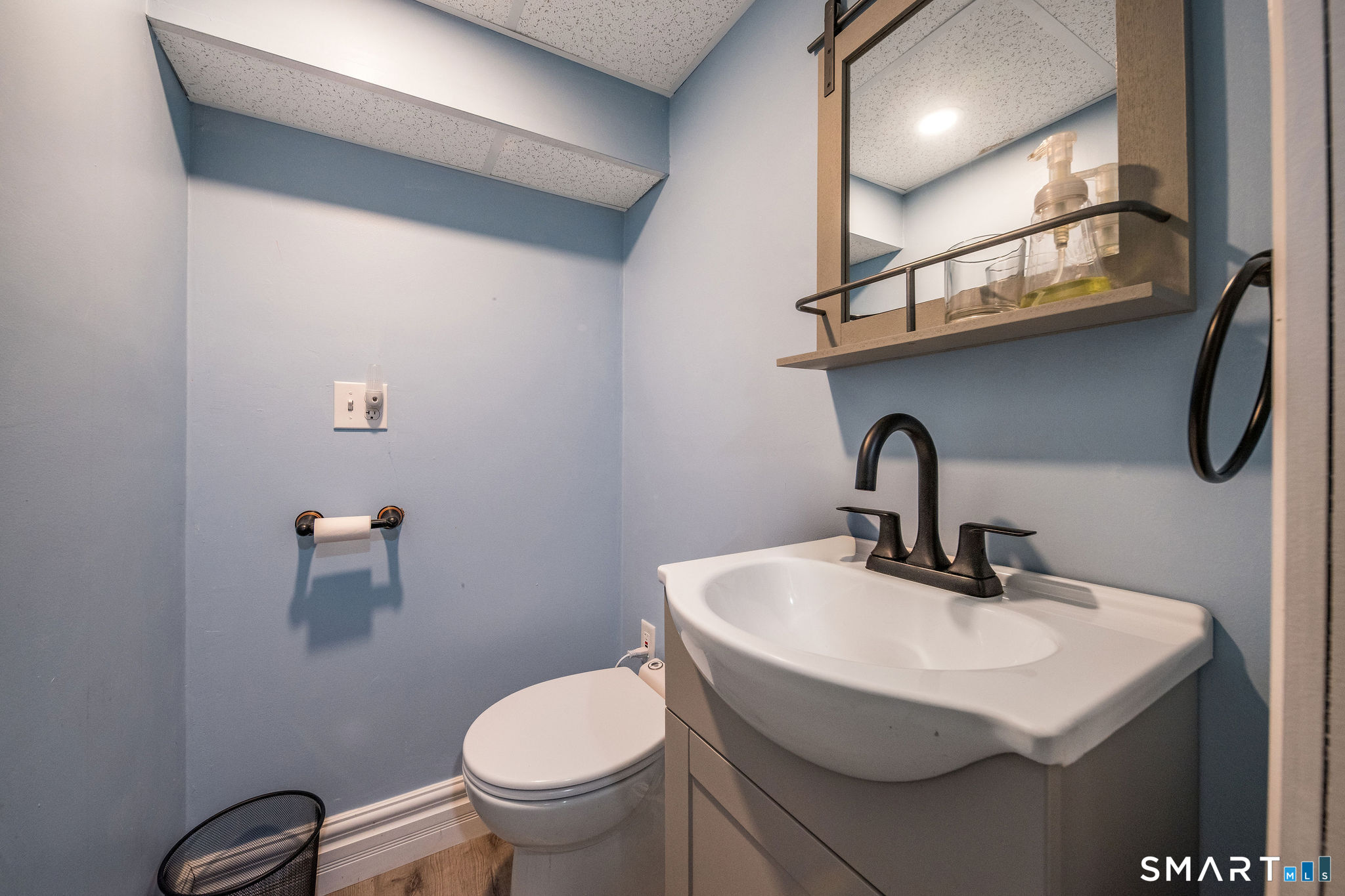 6 Cedar Island Avenue Clinton, CT 06413 - Photo 29 of 36 a bathroom with a sink and a toilet