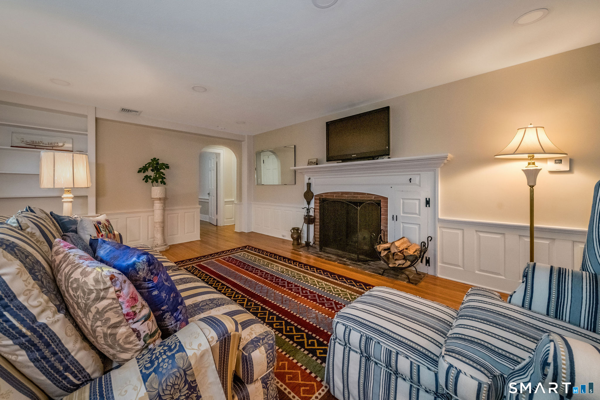 6 Cedar Island Avenue Clinton, CT 06413 - Photo 3 of 36 a bedroom with furniture and a flat screen tv