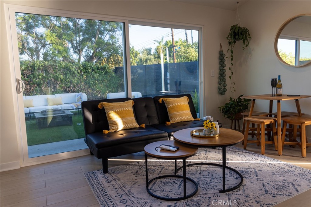 20551 Rhoda Street Woodland Hills, CA 91367 - Photo 3 of 9 a living room with furniture and a large window