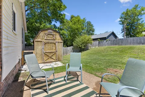 a view of a chairs and table in patio