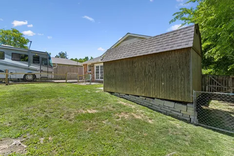 an aerial view of a house with outdoor space