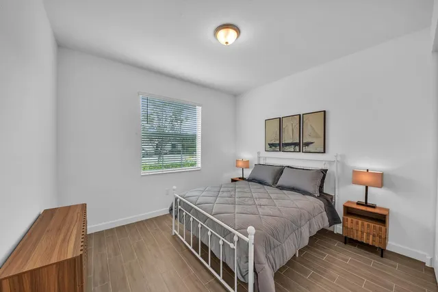 a bathroom with a double vanity sink mirror and shower