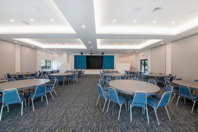 a large space with a window and furniture