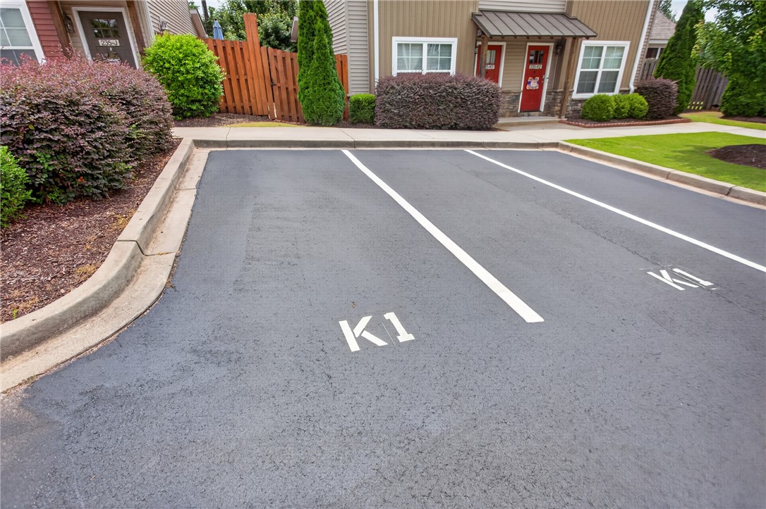 235 Pendleton Road, Unit K1 Clemson, SC 29631 - Photo 4 of 49 Secure parking spaces with clear markings offer convenient access to the nearby residences.
