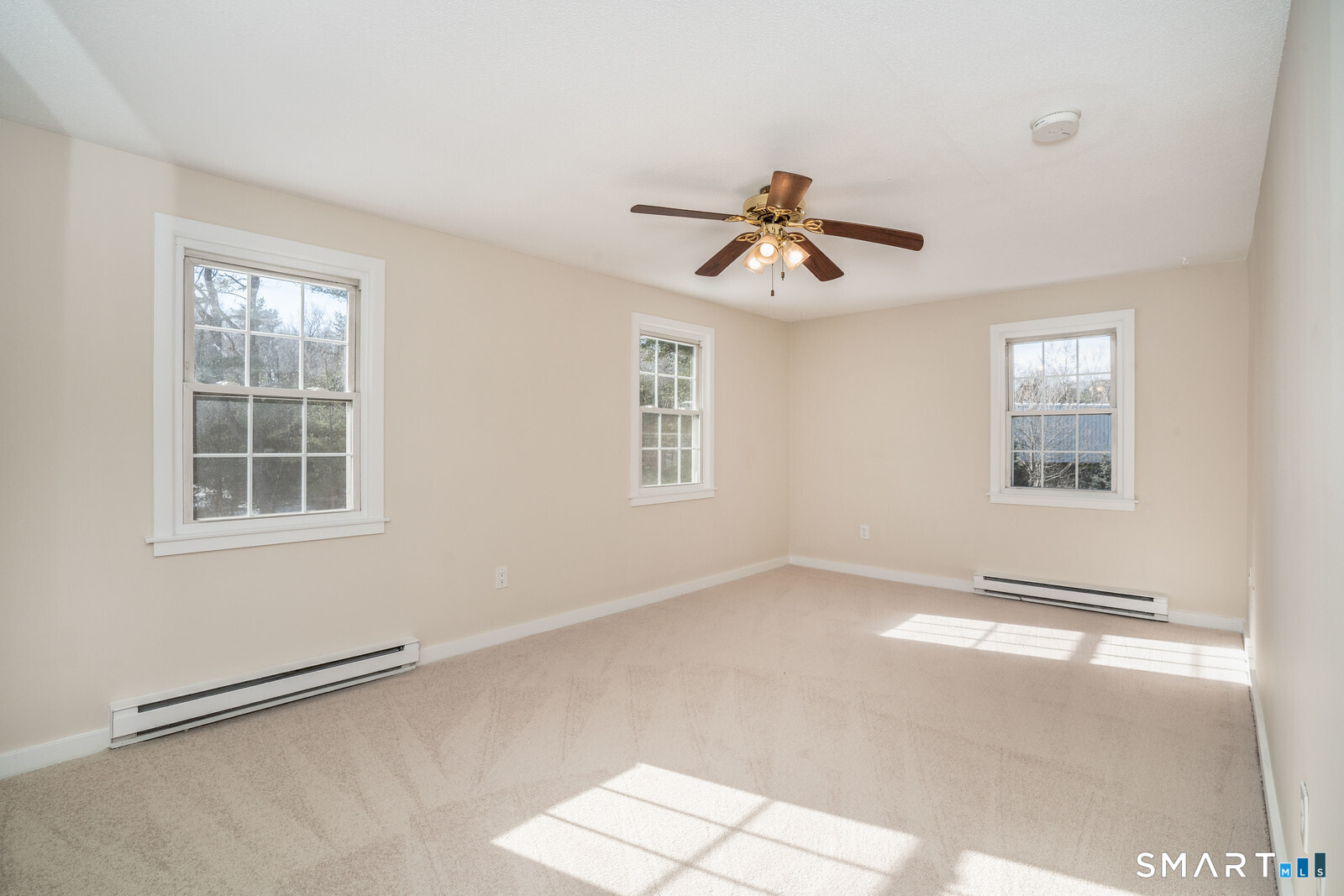 239 Old Farms Road, Unit 7C Avon, CT 06001 - Photo 12 of 17 a view of a livingroom with a ceiling fan and window