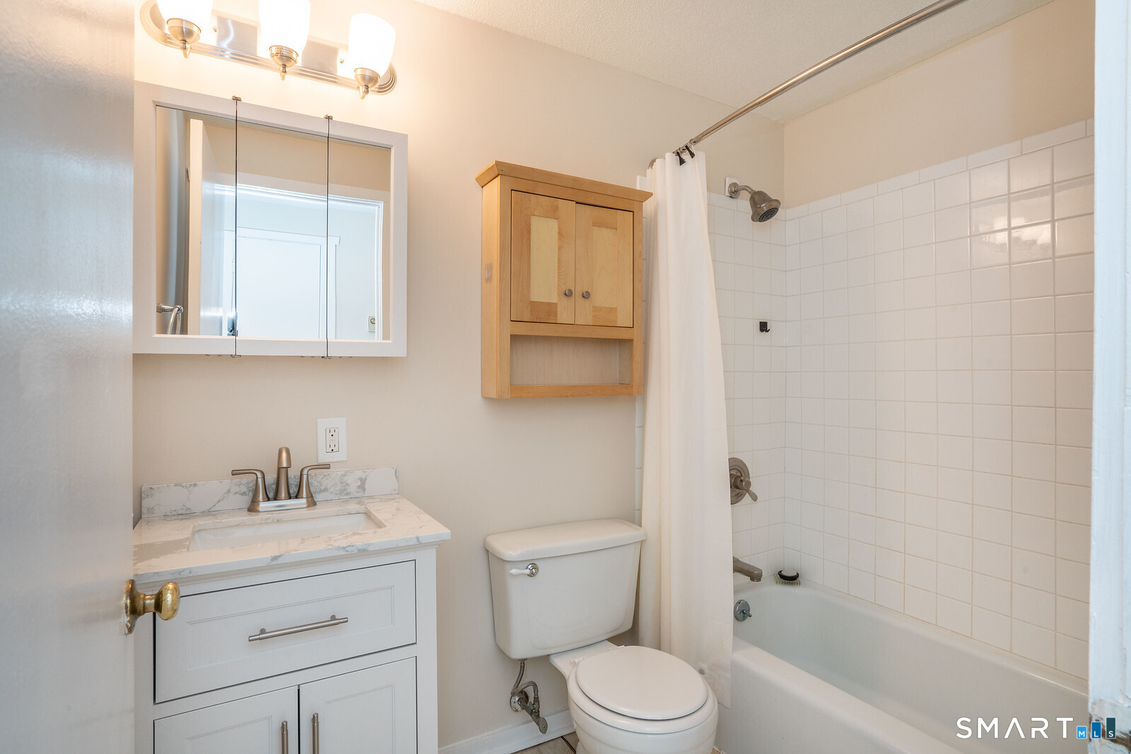239 Old Farms Road, Unit 7C Avon, CT 06001 - Photo 14 of 17 a bathroom with a sink a toilet and shower