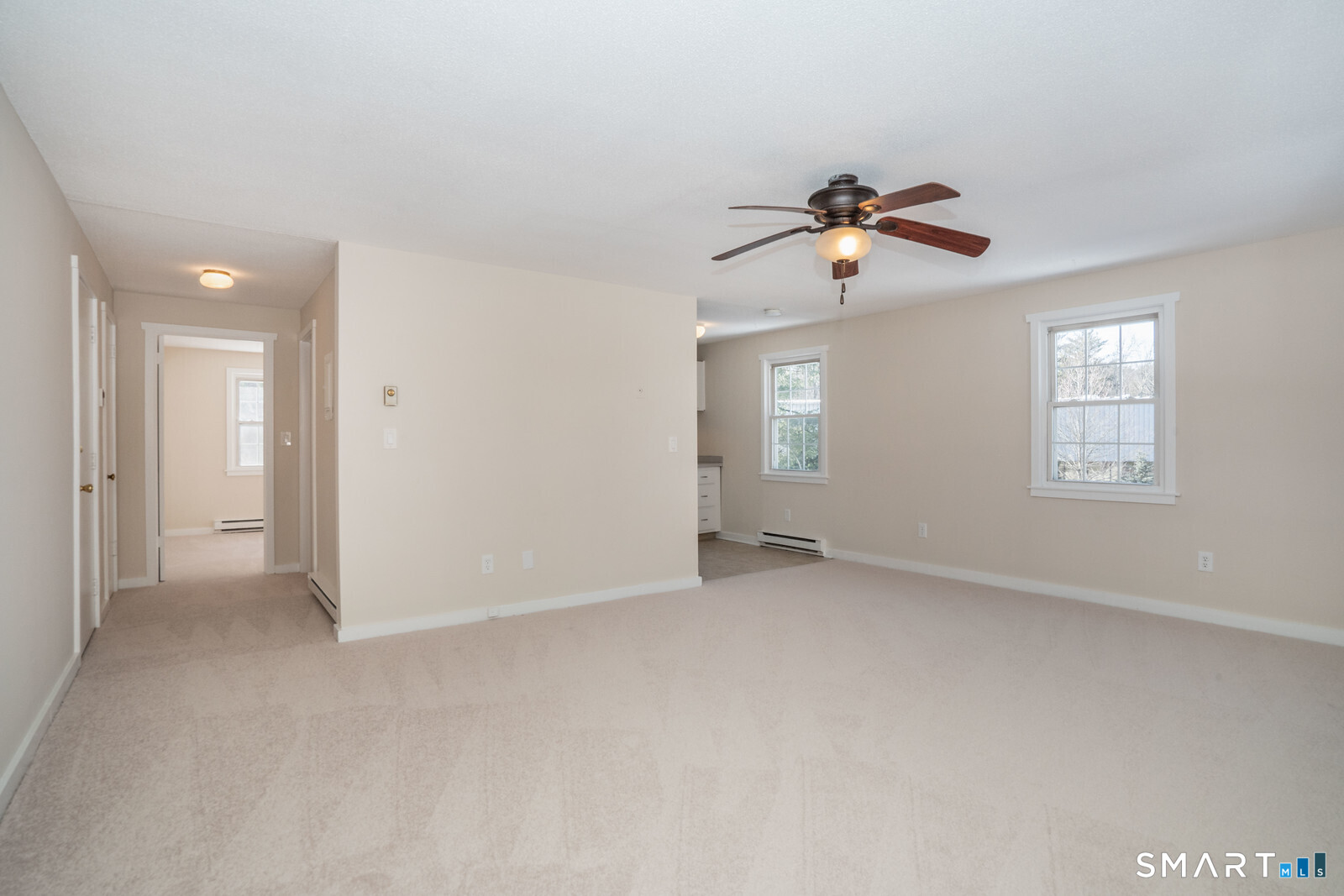 239 Old Farms Road, Unit 7C Avon, CT 06001 - Photo 4 of 17 wooden floor in an empty room with a window
