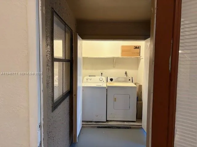 a room with a sink and mirror