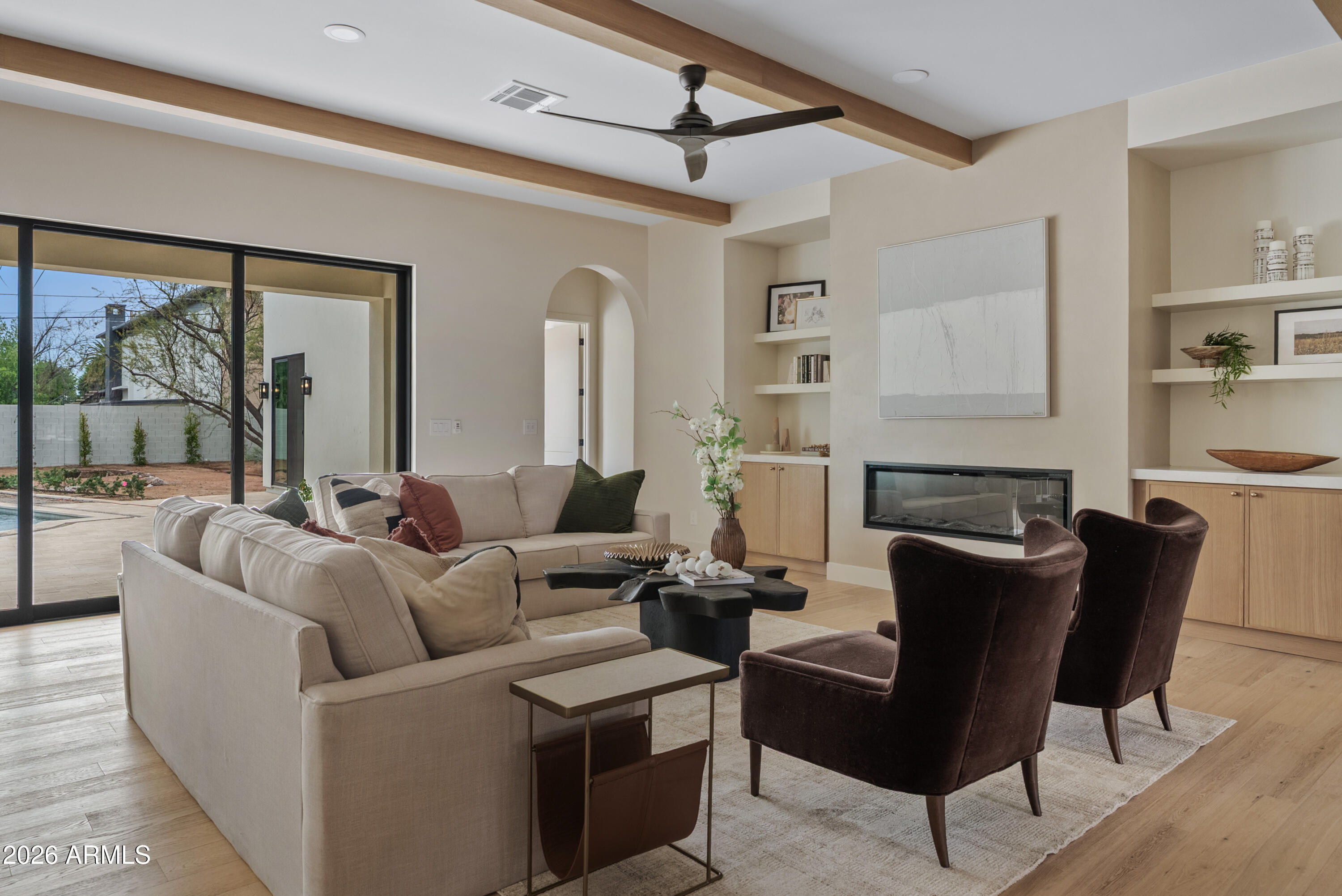 4035 East Osborn Road Phoenix, AZ 85018 - Photo 10 of 63 a living room with furniture and a large window
