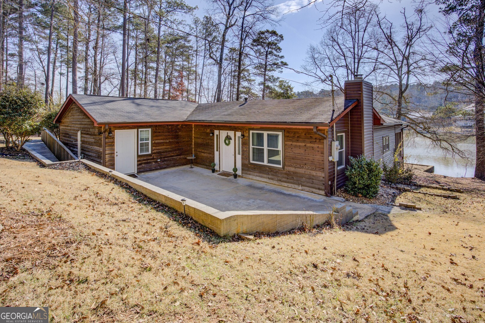162 Collins Road Jackson, GA 30233 - Photo 16 of 77 a front view of house with yard and trees in the background