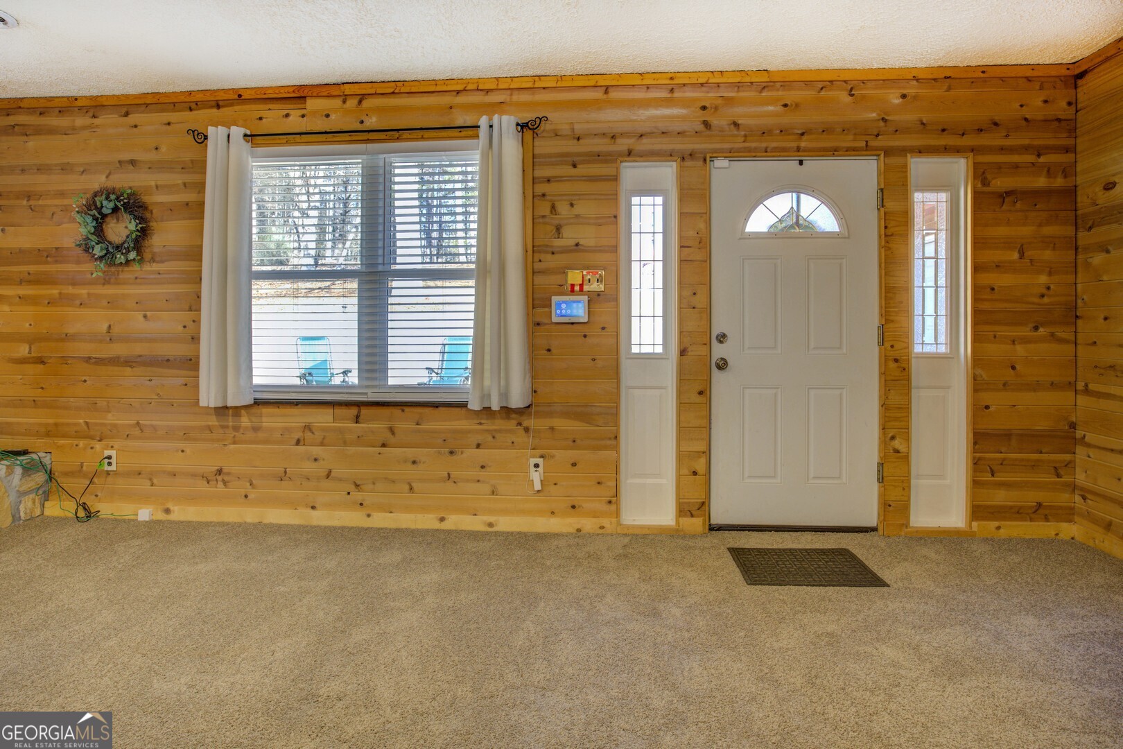 162 Collins Road Jackson, GA 30233 - Photo 21 of 77 a view of a brick house with a door