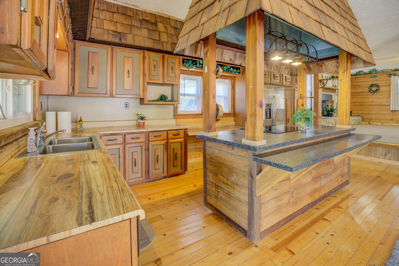 162 Collins Road Jackson, GA 30233 - Photo 28 of 77 a view of a kitchen with stainless steel appliances granite countertop a sink and cabinets