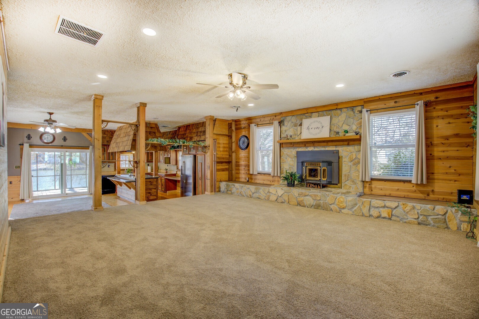 162 Collins Road Jackson, GA 30233 - Photo 35 of 77 a view of an empty room with a fireplace and a window