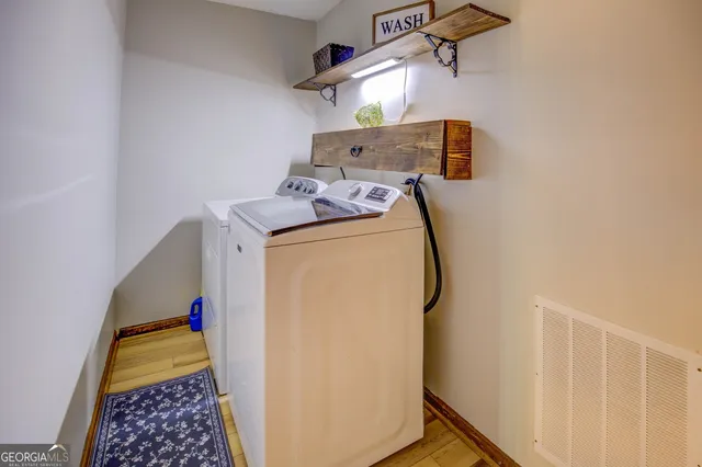 a house with a large tree in front of it