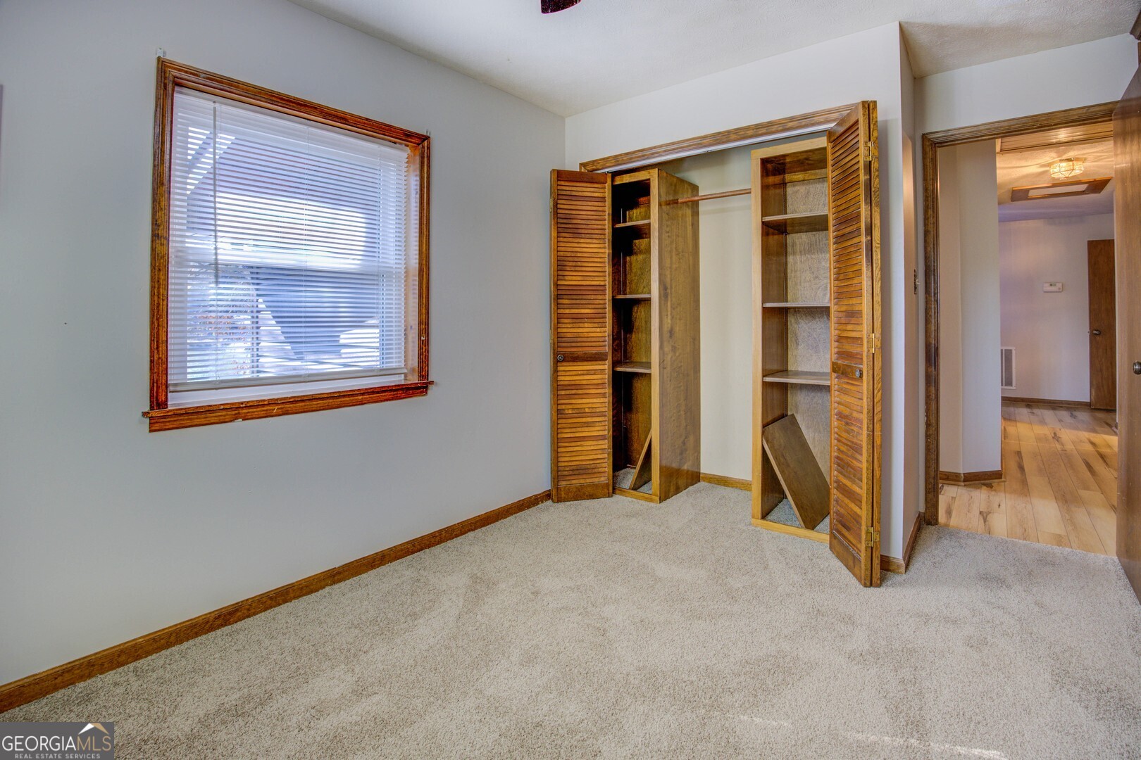 162 Collins Road Jackson, GA 30233 - Photo 45 of 77 an empty room with closet and a window