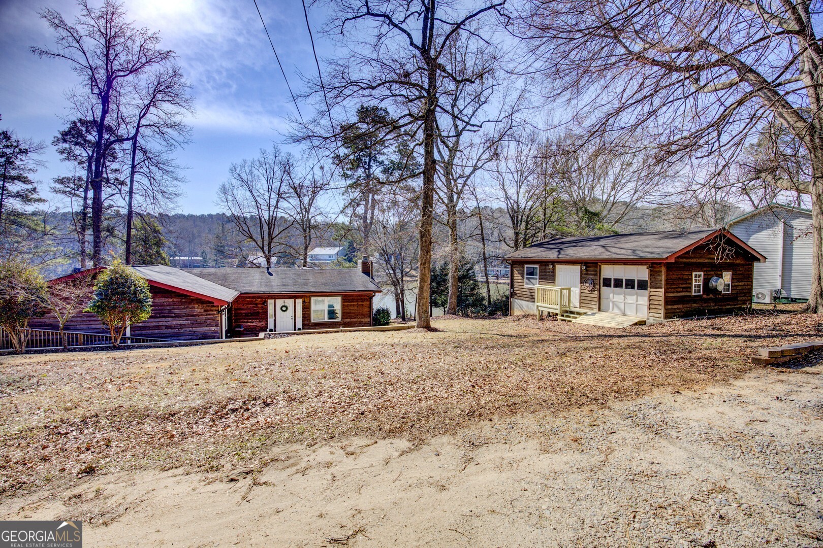 162 Collins Road Jackson, GA 30233 - Photo 5 of 77 a view of a house with a yard covered in snow