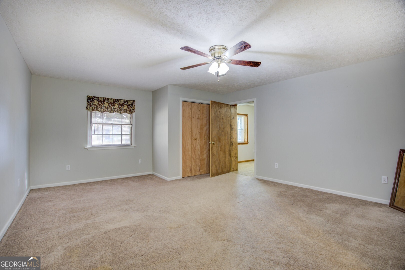 162 Collins Road Jackson, GA 30233 - Photo 52 of 77 a view of an empty room with a window