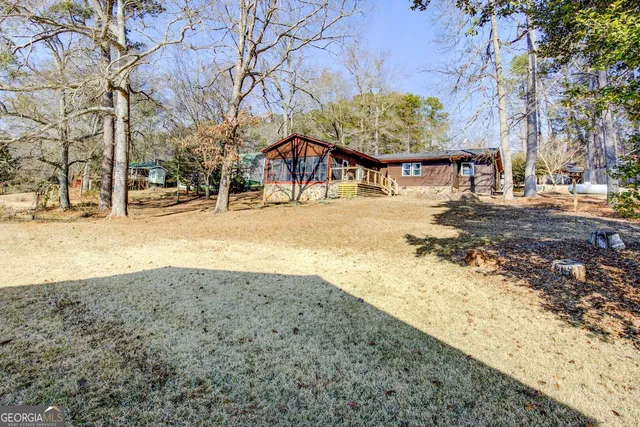 a view of a swimming pool with a patio