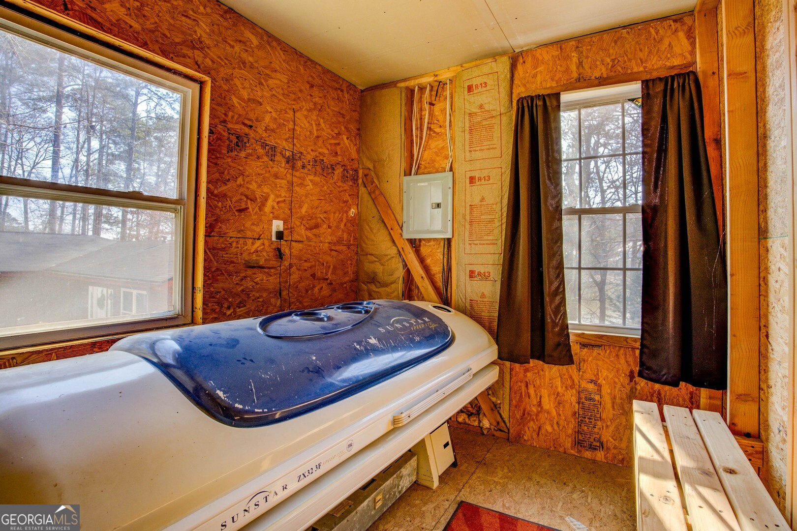 162 Collins Road Jackson, GA 30233 - Photo 68 of 77 a bedroom with a bed and a dresser next to a window