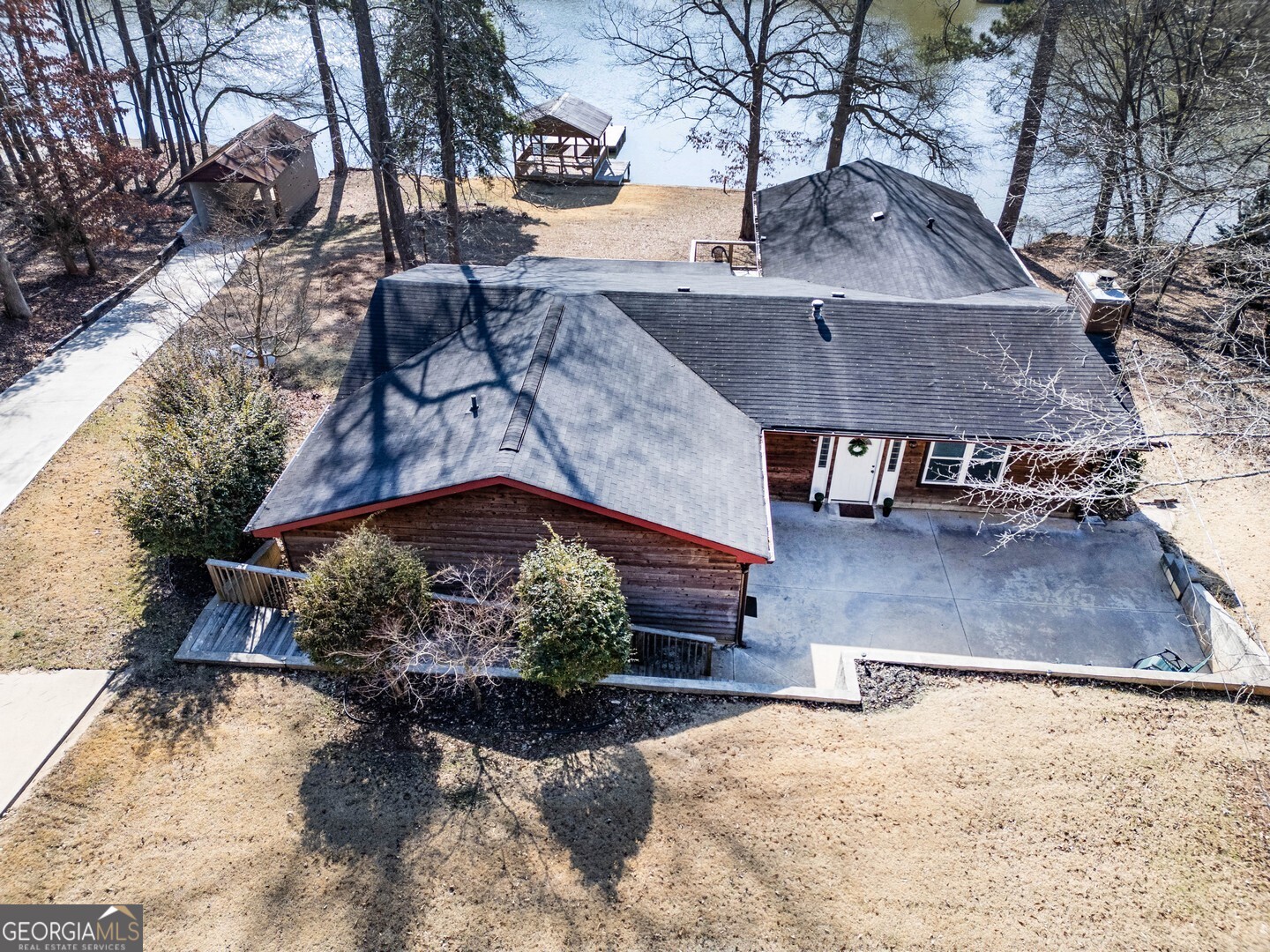 162 Collins Road Jackson, GA 30233 - Photo 7 of 77 a view of a house with a yard covered with snow