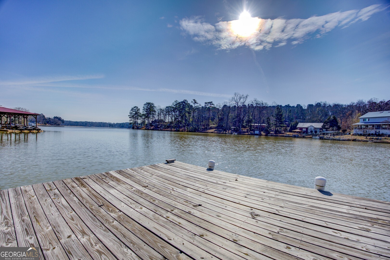 162 Collins Road Jackson, GA 30233 - Photo 73 of 77 a view of a lake with houses in the back