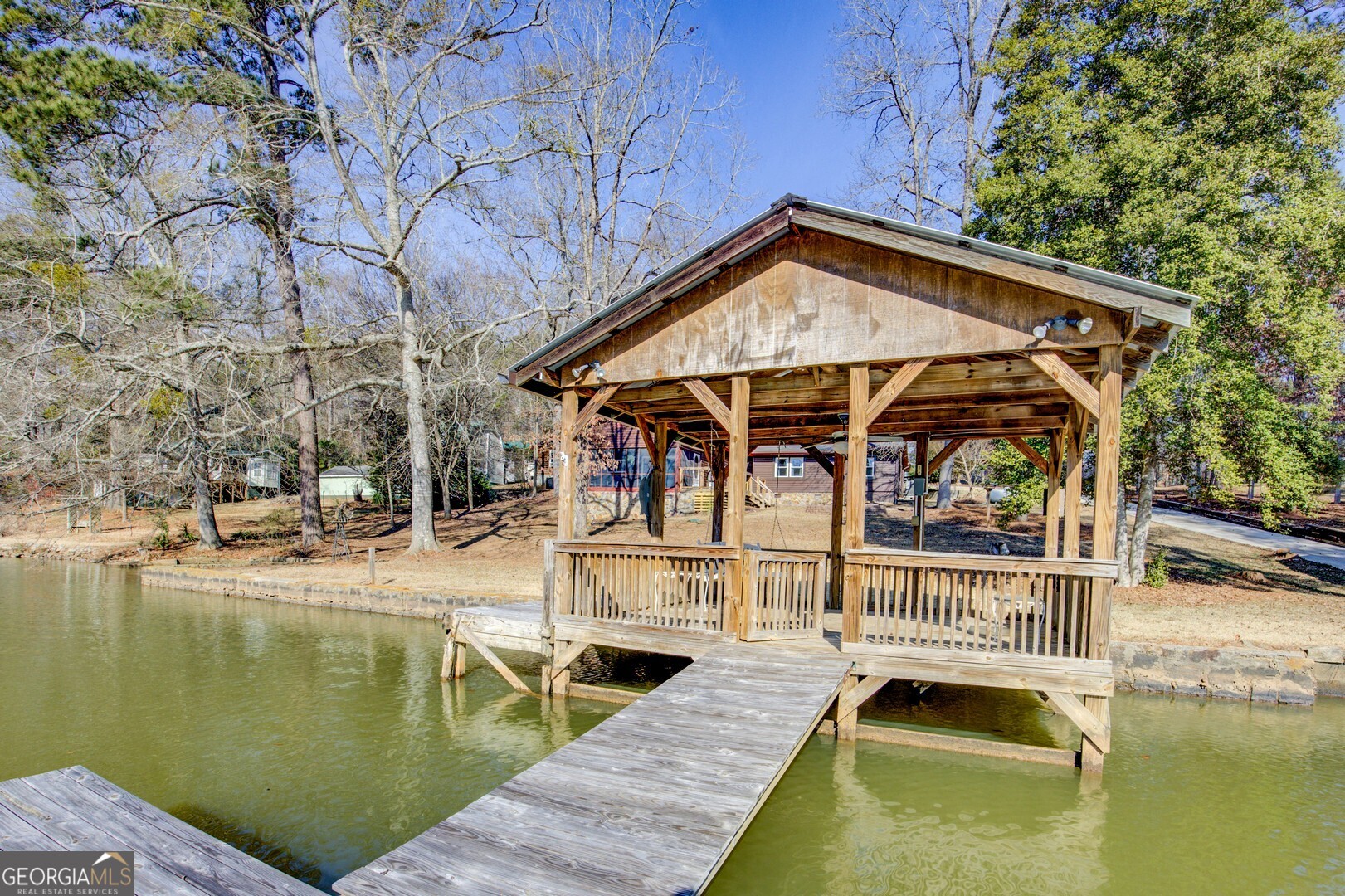 162 Collins Road Jackson, GA 30233 - Photo 10 of 77 a view of a swimming pool with a patio