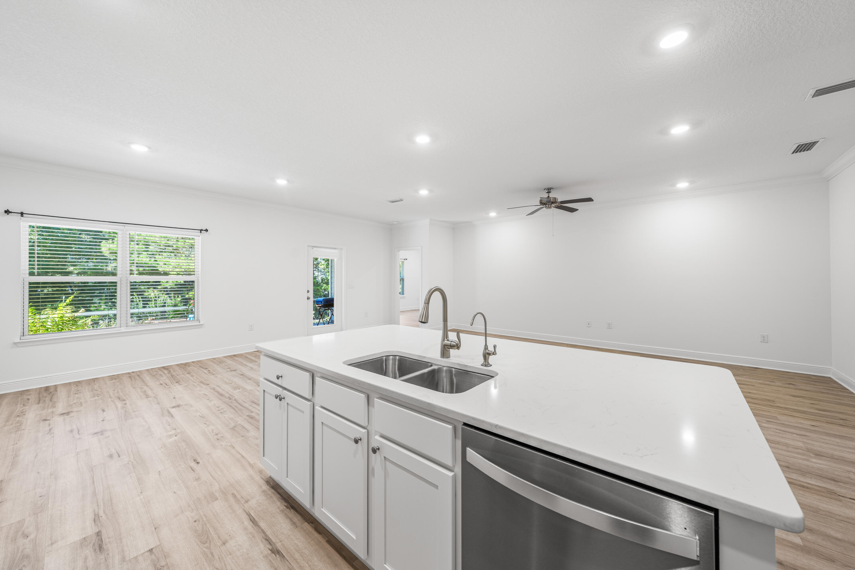 157 Jr's Way Santa Rosa Beach, FL 32459 - Photo 12 of 45 a kitchen with a sink and wooden floor
