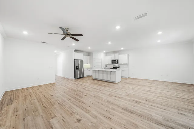 a view of kitchen with wooden floor and window