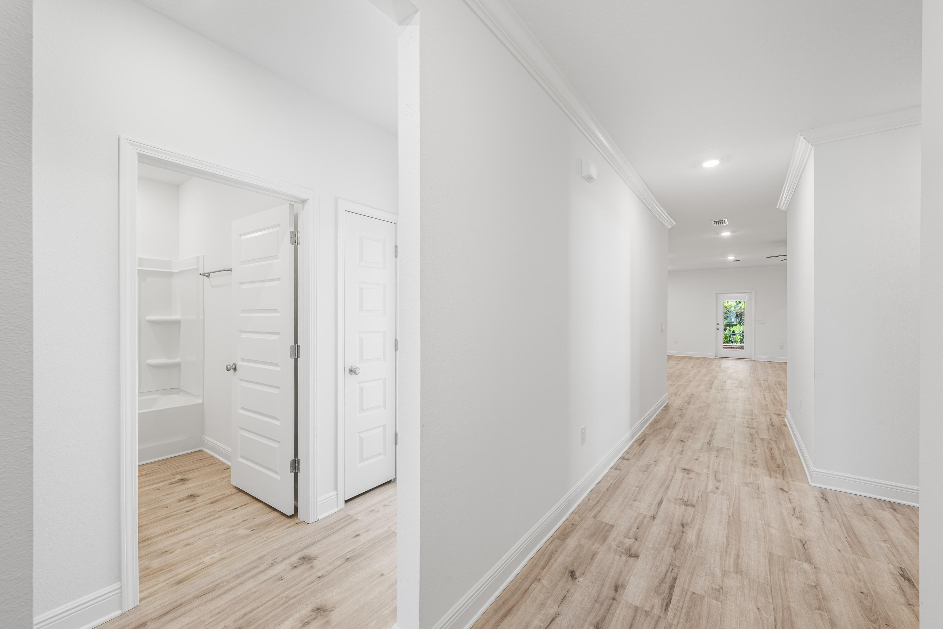 157 Jr's Way Santa Rosa Beach, FL 32459 - Photo 16 of 45 a view of a hallway view with wooden floor and staircase